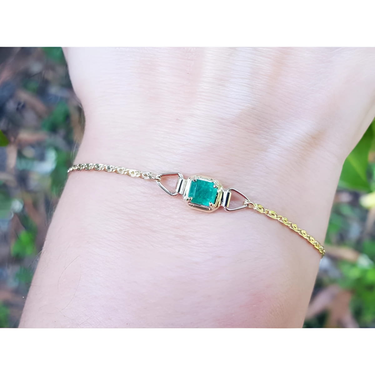 14k yellow gold bracelet with a square natural colombian emerald prong set solitaire.