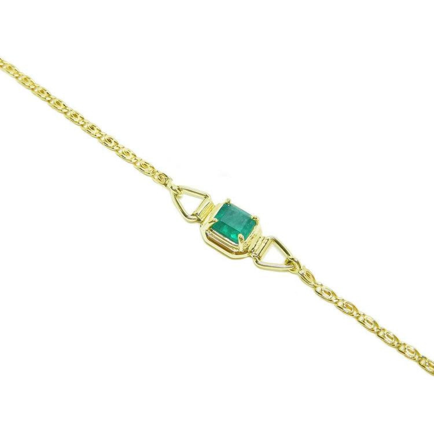 14K yellow gold solitaire bracelet with a deep green Colombian emerald.
