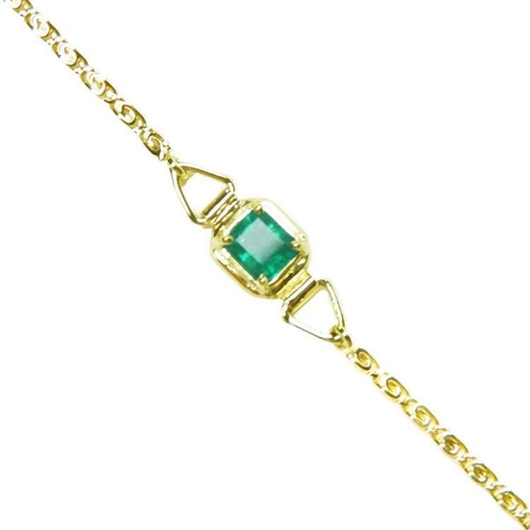 A square natural colombian emerald solitaire bracelet prong set in 14k yellow gold.