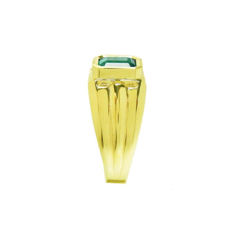 Men's 14K yellow gold solitaire ring with a bezel-set, deep green emerald.