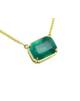 5.52 carat emerald-cut Colombian emerald solitaire necklace in 18K yellow gold.
