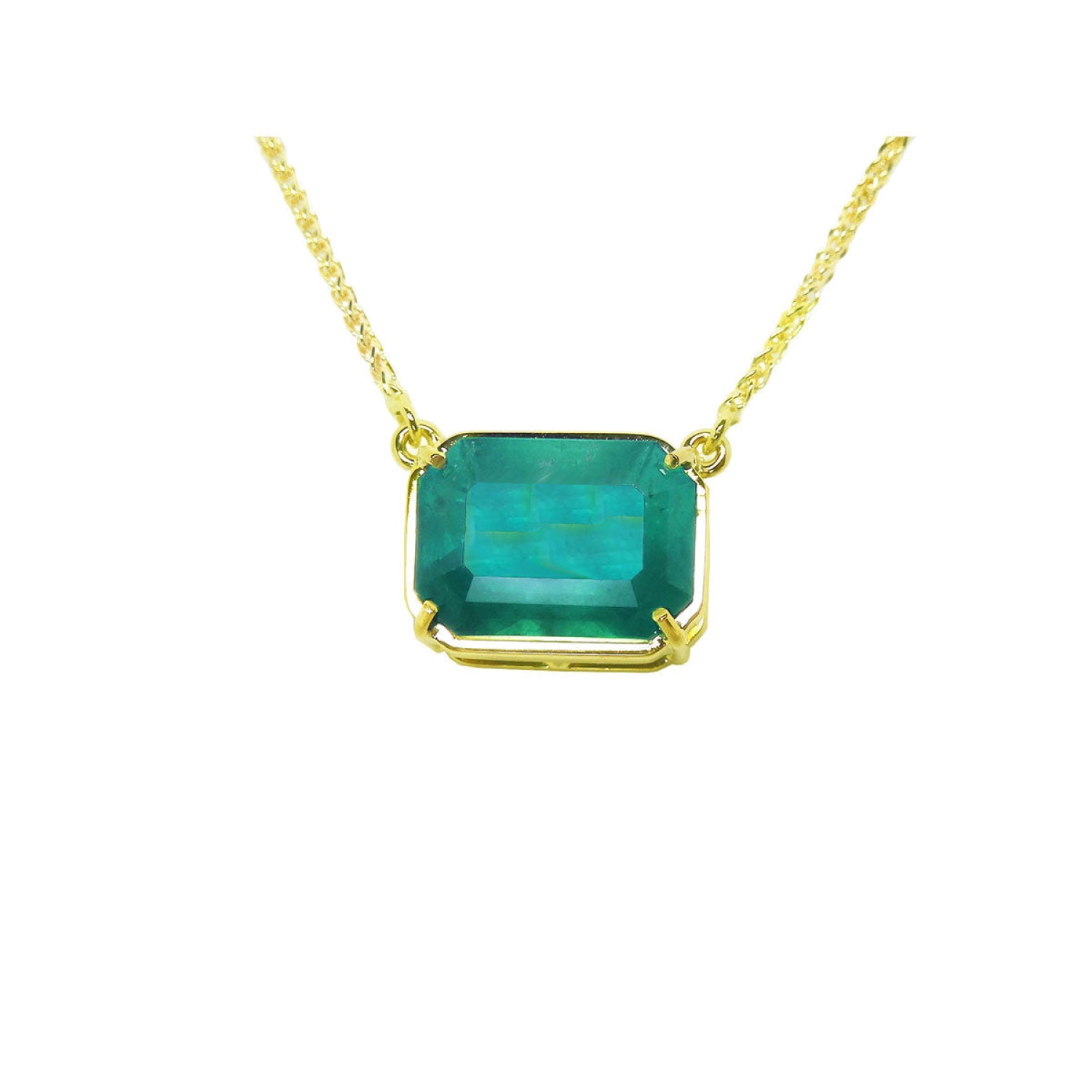 Colombian emerald solitaire necklace sourced from the Muzo mine, set in a handcrafted 18k yellow gold frame