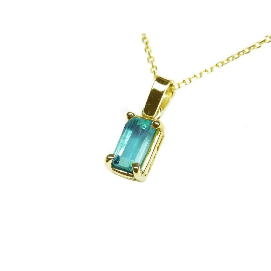 1.31 ct. emerald solitaire pendant in 14K yellow gold with a basket setting on a delicate chain.