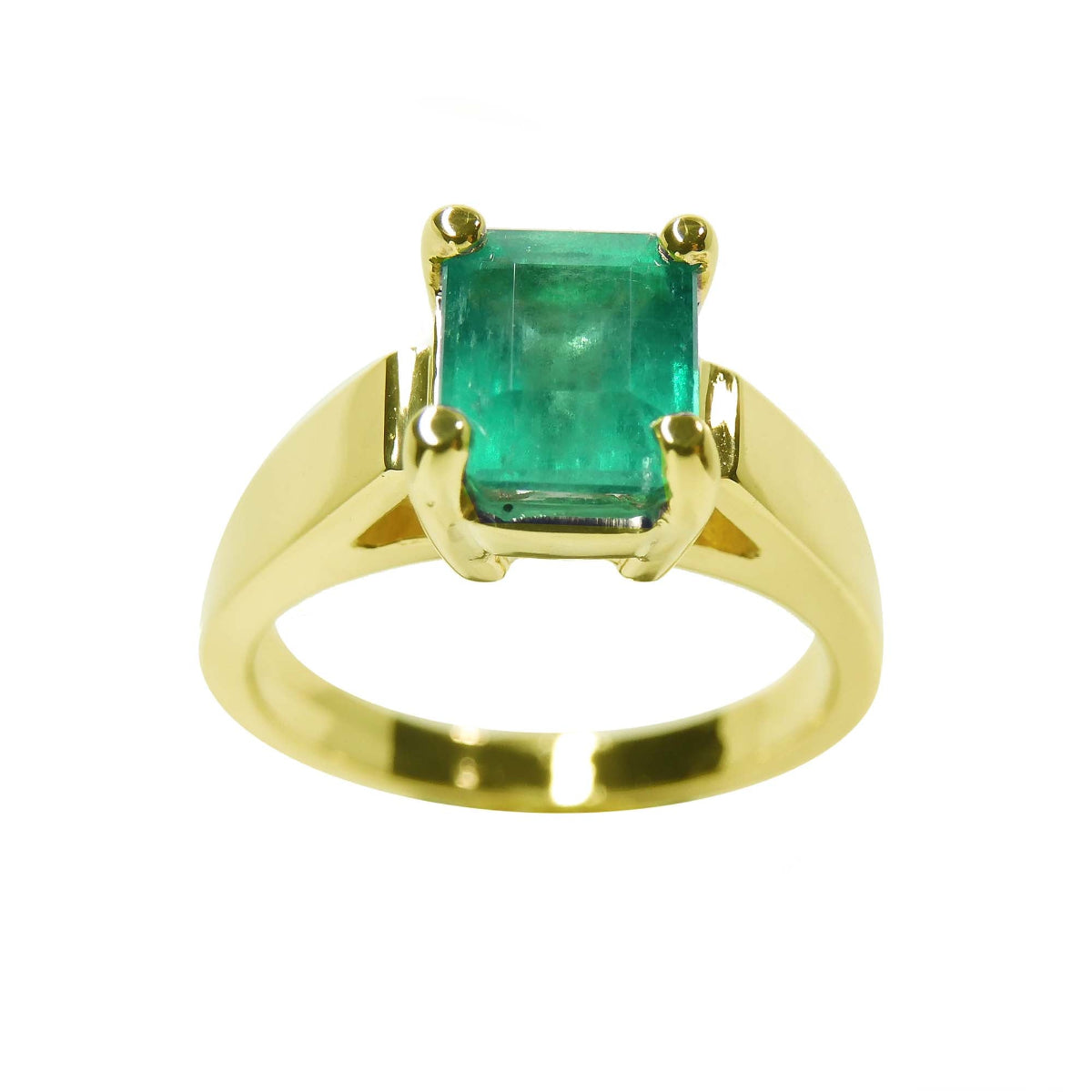A Natural colombian emerald solitaire ring for women made of 14k yellow gold.