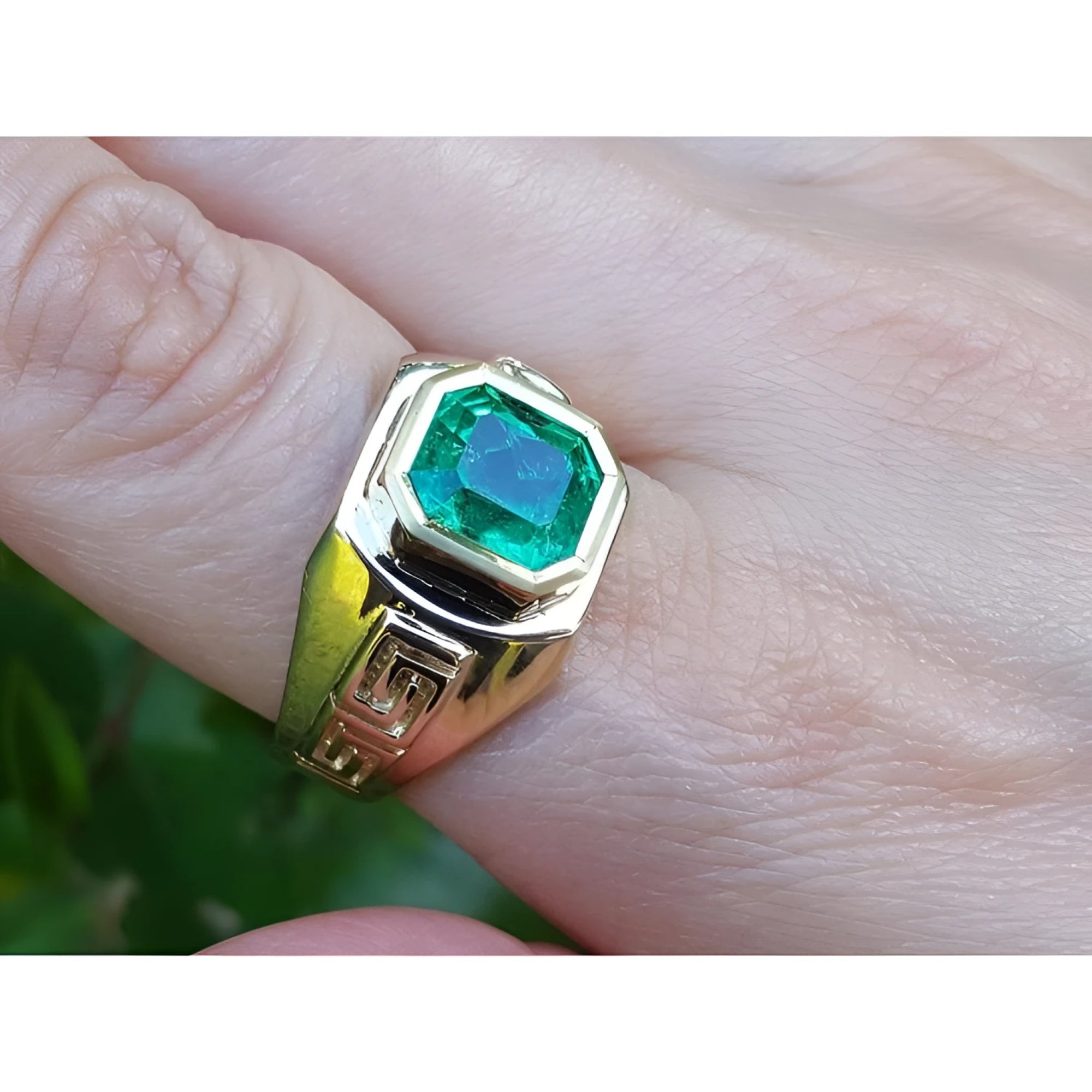 A 14k yellow gold men’s ring featuring a square emerald-cut natural Colombian emerald, bezel-set for a sleek and refined look.
