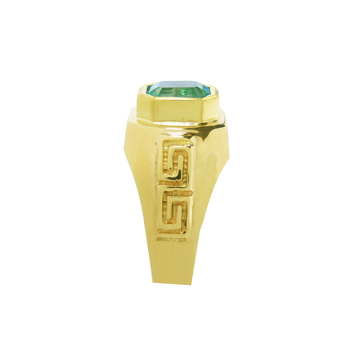 Side view of a men&#39;s natural emerald ring displaying its top setting and side band design Greek decoration.
