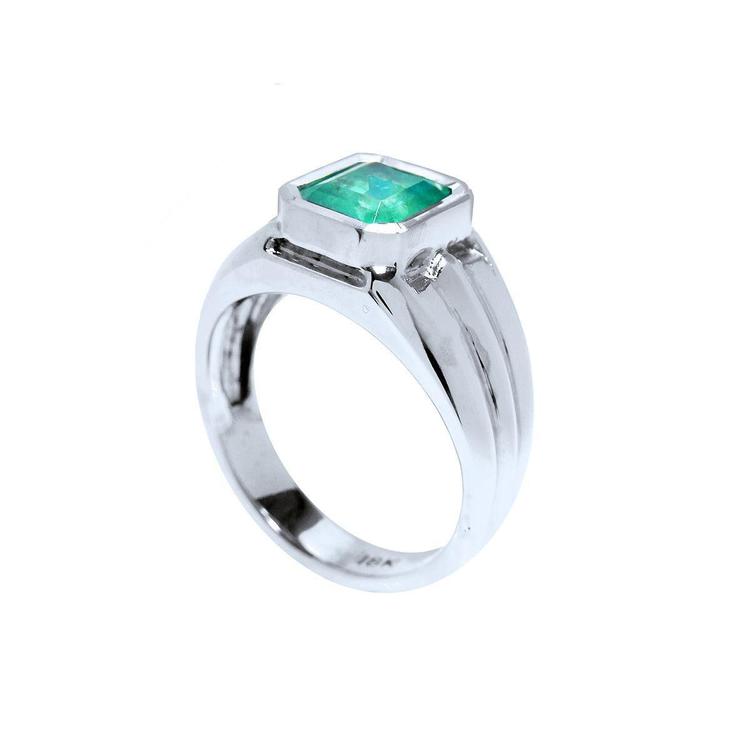 Emeral ring in white gold for men displaying the top and partial side view.