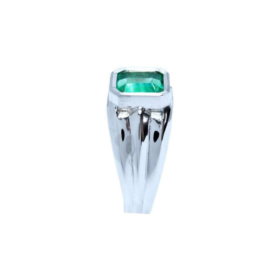 Men's 18K white gold solitaire ring with a bezel-set, rectangular Muzo emerald.
