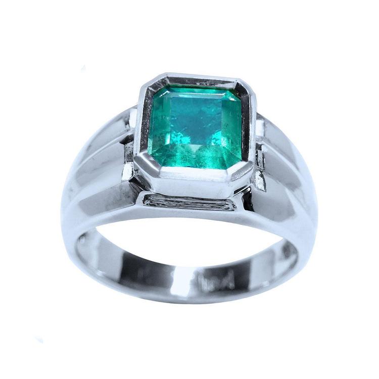 A white gold men's emerald ring bezel set solitaire on a top and sides view position.