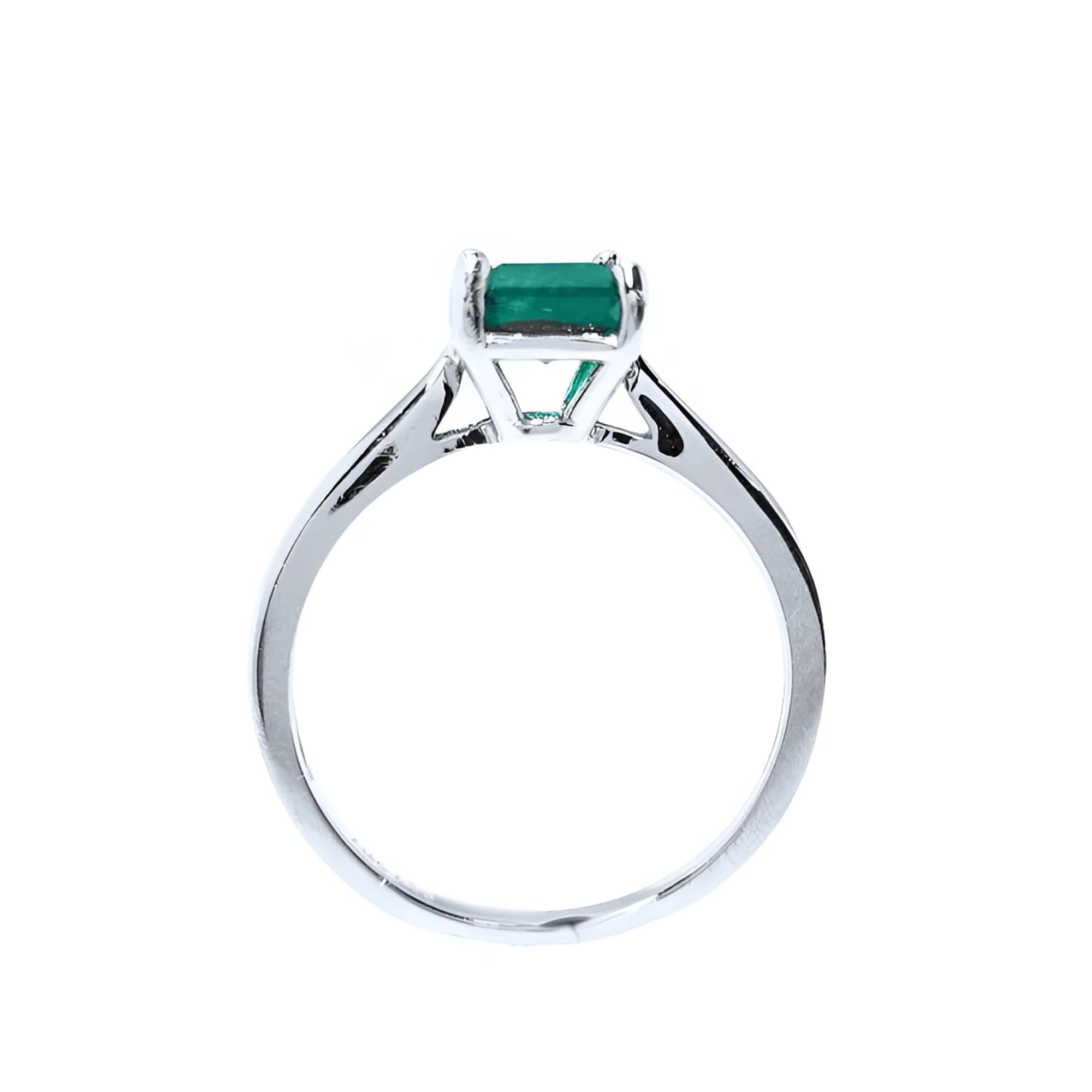 Colombian emerald solitaire silver ring with a square emerald cut gemstone in a four-prong setting.