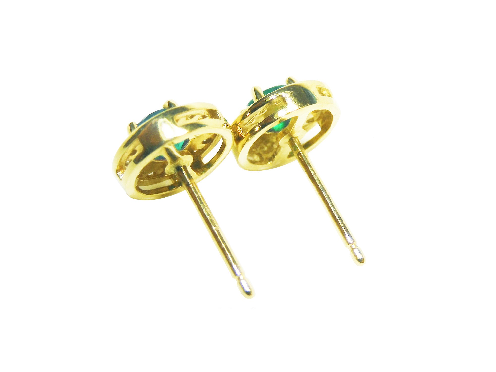 A pair of yellow gold emerald stud earrings underside post&#39;s view push backs.