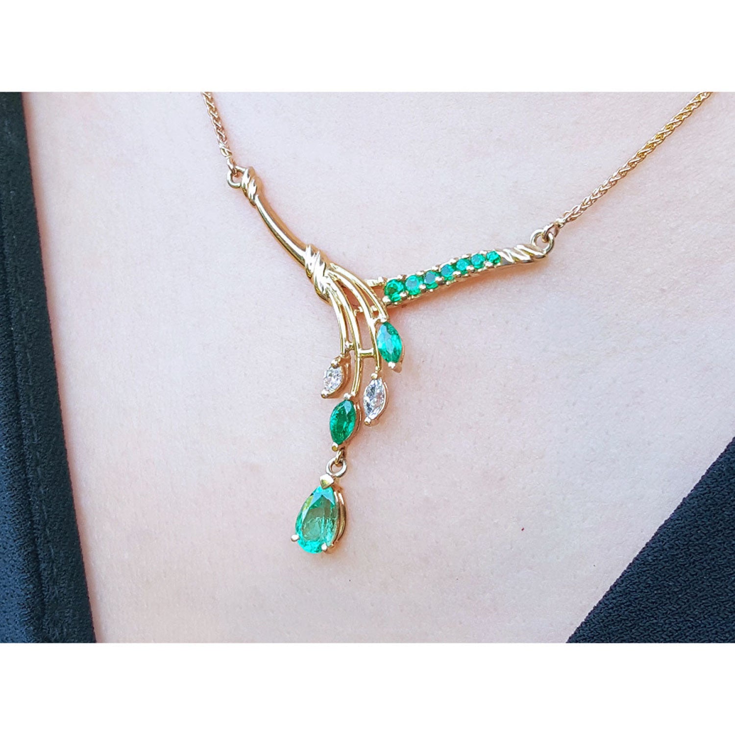 14K gold necklace with marquise and pear shaped Colombian emeralds and diamonds.