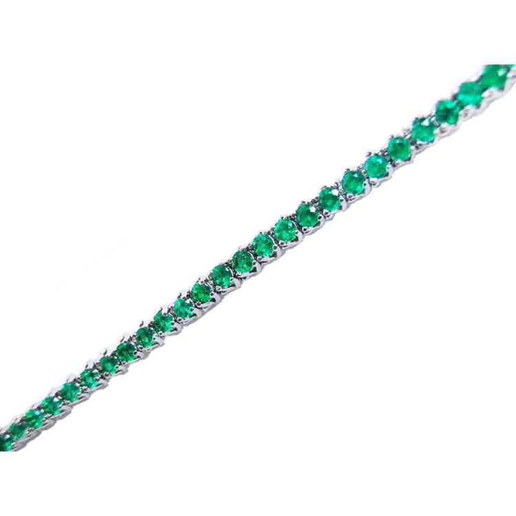 Natural Colombian emeralds tennis bracelet, round cut, prong set in 14K gold.