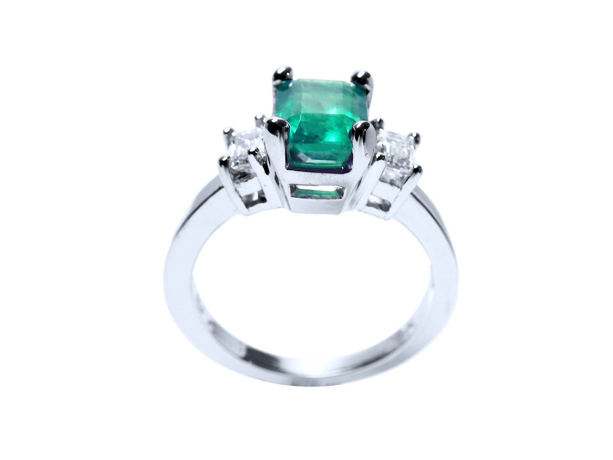 This natural emerald and side diamonds ring for women has a visible top and galley profile.