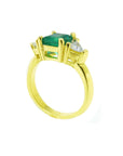 Tree stone emerald ring, trillion side natural diamonds crated in 18k yellow gold.