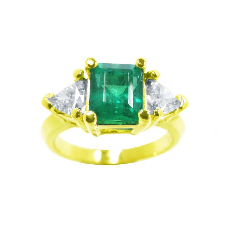 18k yellow gold ring with a natural colombian emerald and side trillion cut diamonds on sale at factory price.