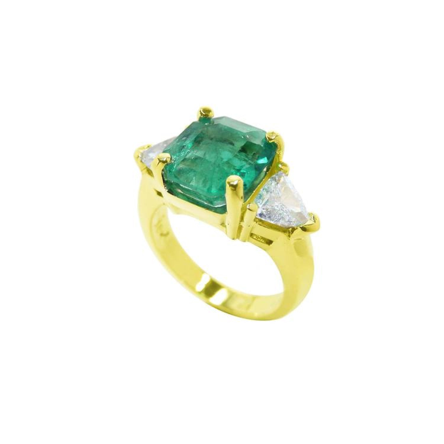 18k yellow gold ring with a large natural emerald and two trillion side diamonds.