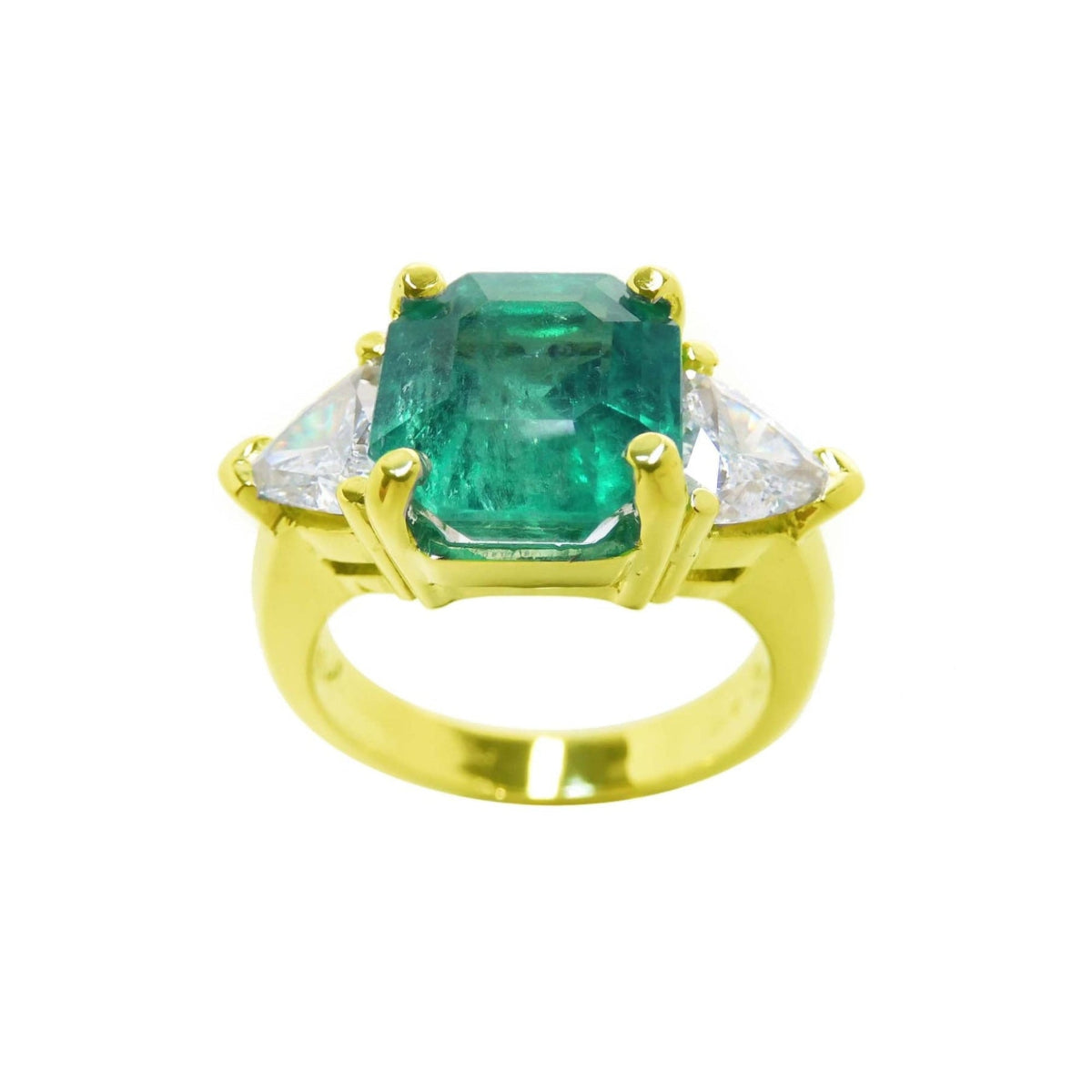 GIA certified emerald and trillion cut side diamond ring, front side position, top and side diamonds visible.