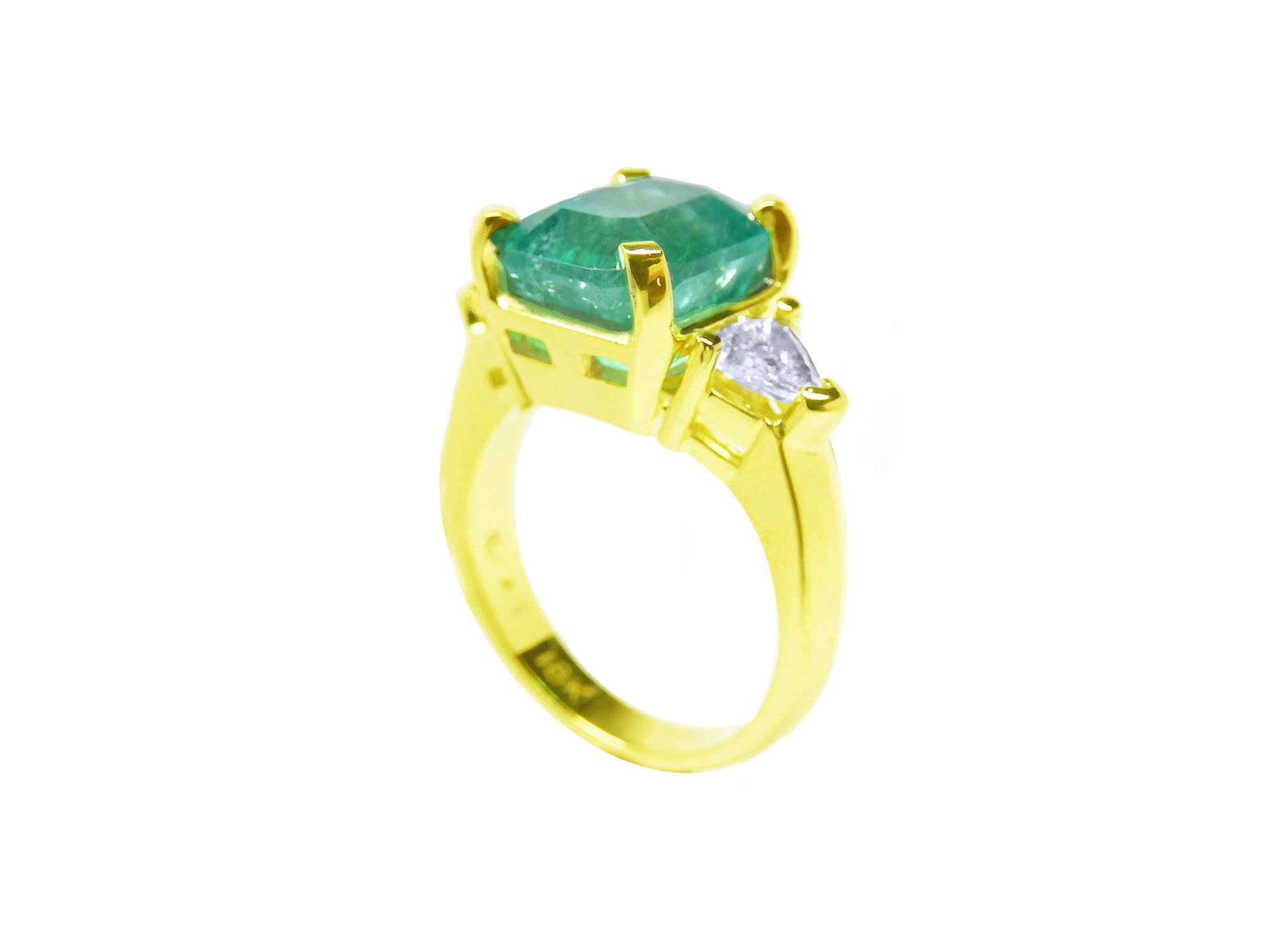 This yellow gold emerald ring for ladies has a top view with gallery display.