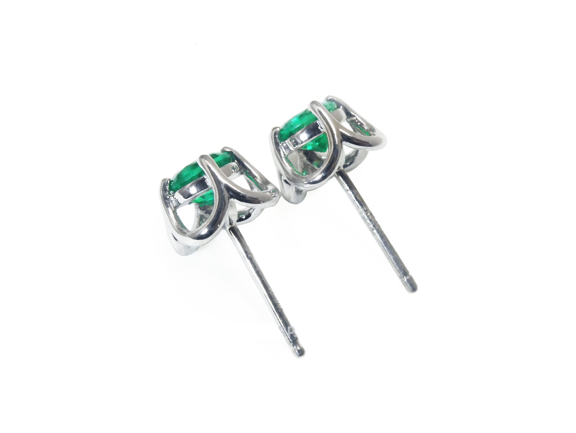 underside view of a pair of real Colombian emerald stud earrings, downside detail&#39;s view