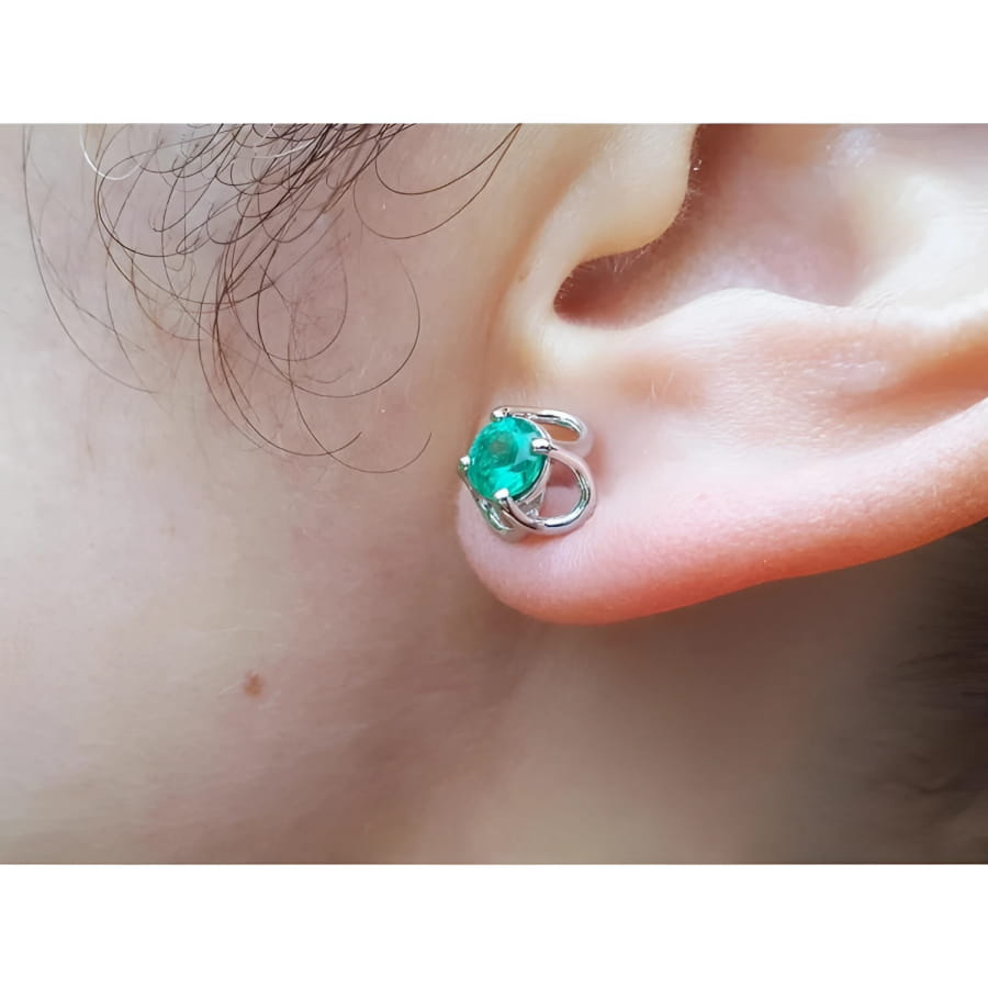 Tulip emerald stud earrings with round cut natural Muzo Colombian emeralds in 14K white gold.