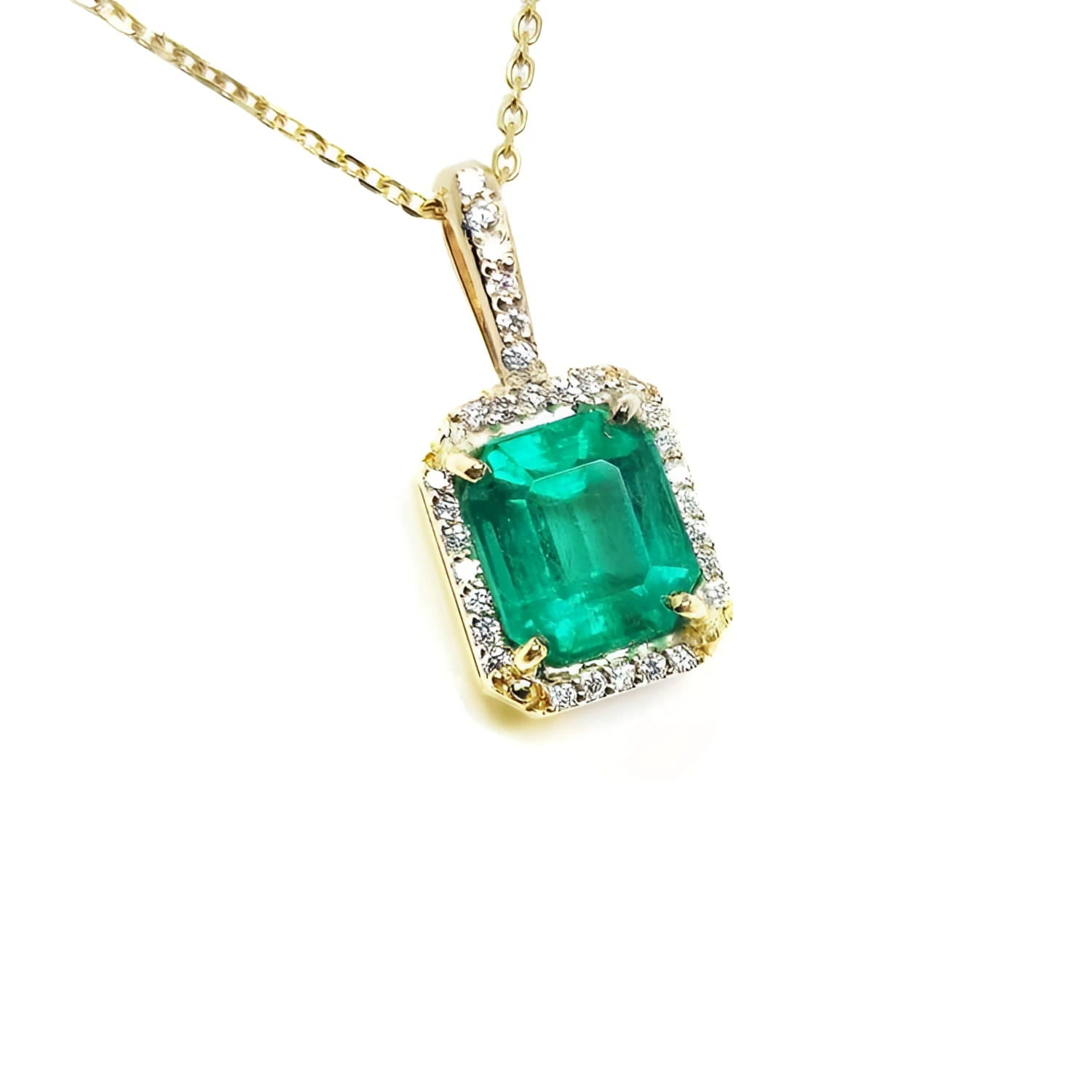 Gold necklace with a natural emerald pendant on a right-side profile view