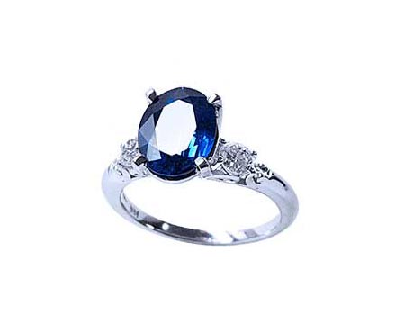 An oval cut natural sapphire engagement ring crafted in 14k white gold. September birthstone.