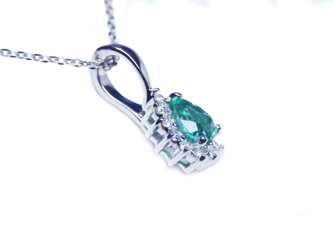 This enhancer emerald pendant is showing the downside gallery profile view.