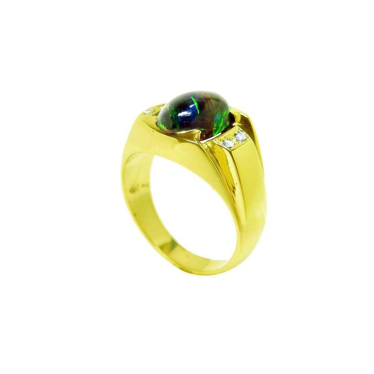 Gold ring with a natural black opal and small side diamonds on a top and partial side perspective view.