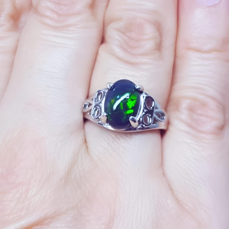 Sterling silver ring with a 2.15 ct oval black Ethiopian opal, showing green-blue play of color.