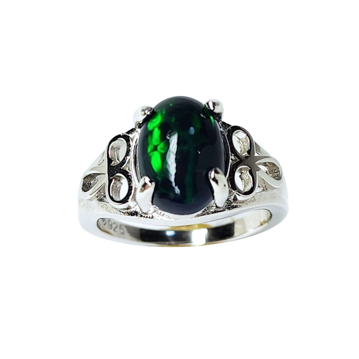 The topside view of a silver ring with a black Ethiopian opal on a white background