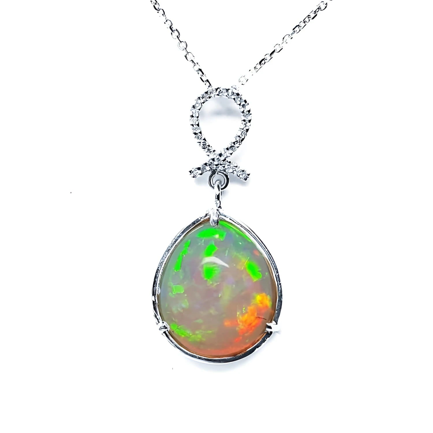 Ethiopian Welo opal pendant with multicolor shimmer, diamond bail, and 14K white gold chain.