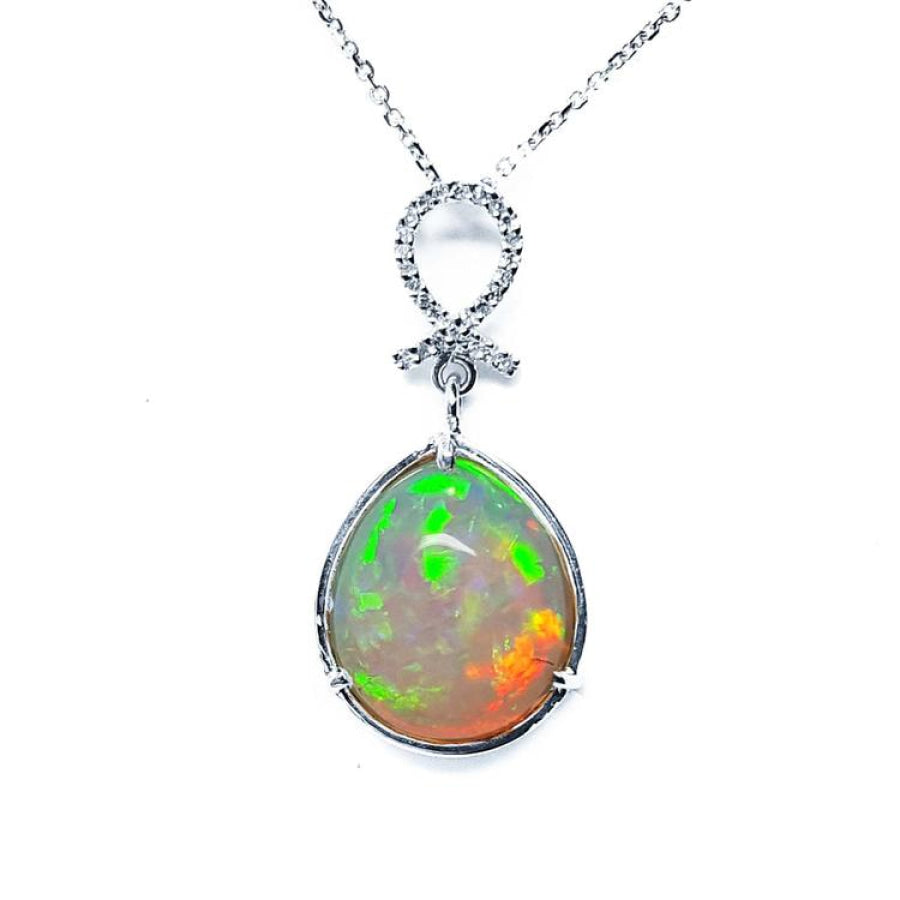 Ethiopian Welo opal pendant with multicolor shimmer, diamond bail, and 14K white gold chain.