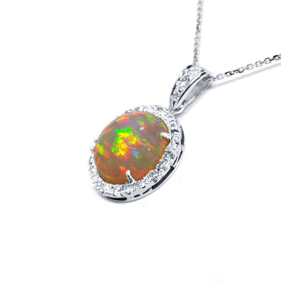 Ethiopian Welo opal pendant with red flashes, diamond halo, and 14K white gold chain.