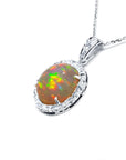 Ethiopian Welo opal pendant with red flashes, diamond halo, and 14K white gold chain.