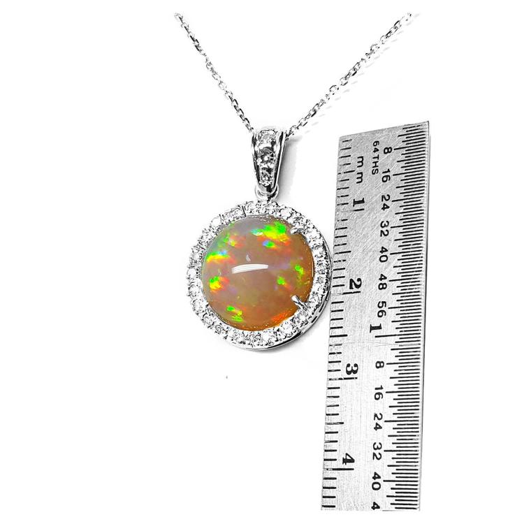 Ethiopian Welo opal pendant with red flashes, diamond halo, and 14K white gold chain.