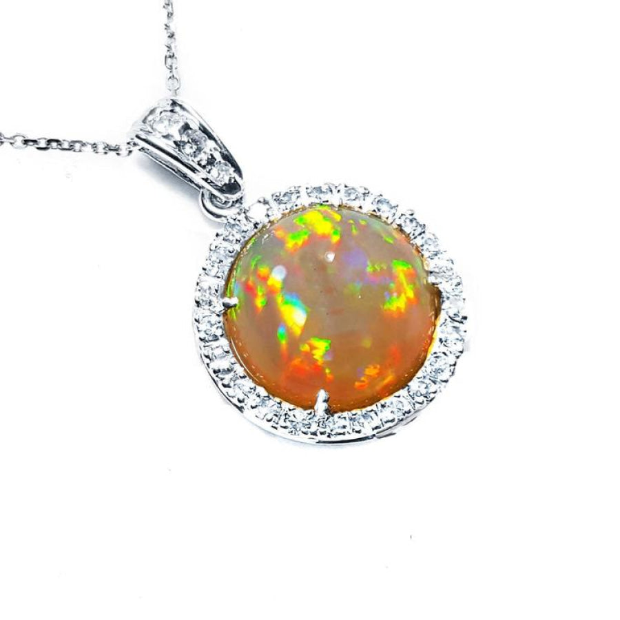 Ethiopian Welo opal pendant with red flashes, diamond halo, and 14K white gold chain.