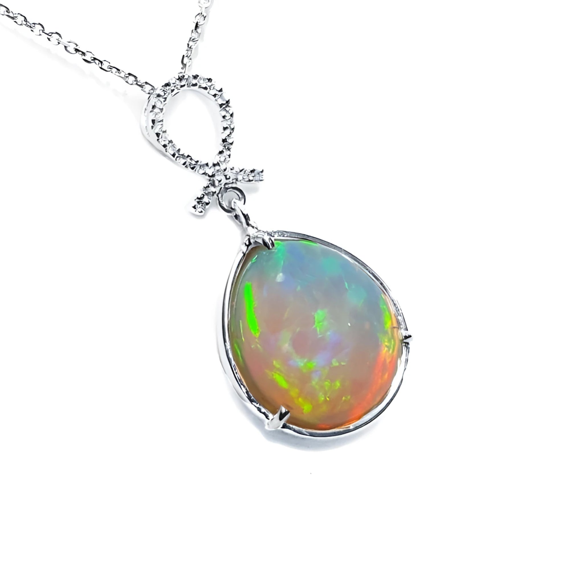 7.76 ct. Ethiopian Welo Opal and Diamond Pendant in 14K White Gold, featuring a pear-shaped opal with multicolor shimmer.