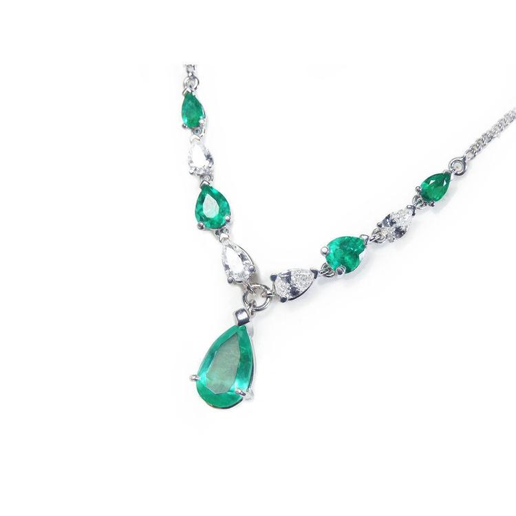 Emerald and diamond necklace: Natural diamonds pear shaped linked in 14k white gold individual settings