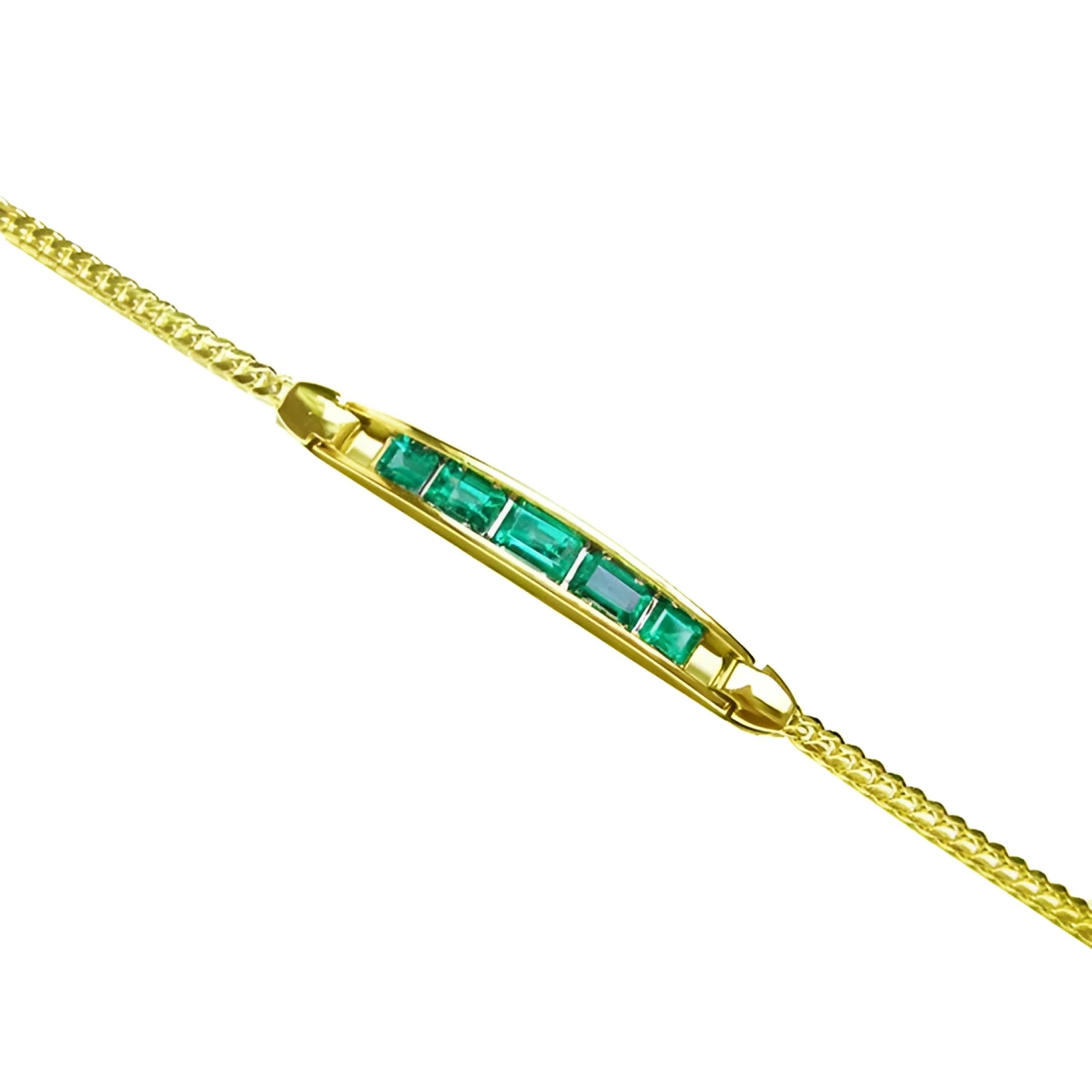 14K yellow gold bracelet with five emerald-cut Colombian emeralds.