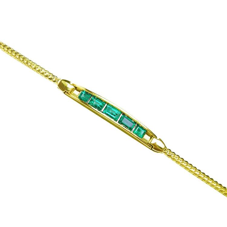14K yellow gold bracelet with five emerald-cut Colombian emeralds.