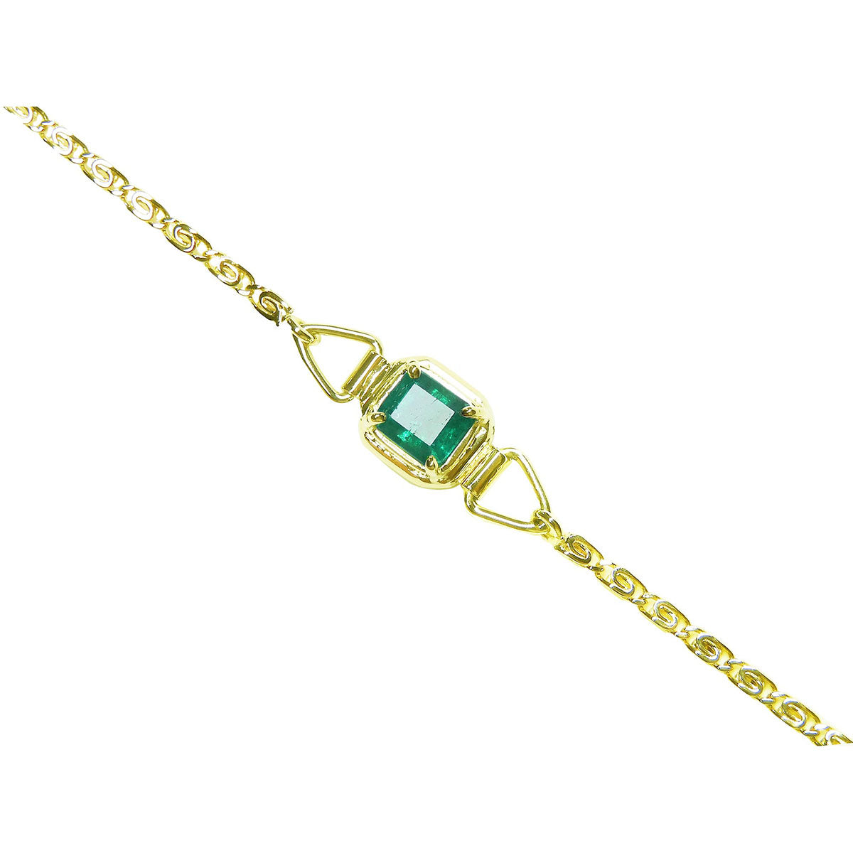 Gold bracelet with a natural colombian emerald on a topside view.