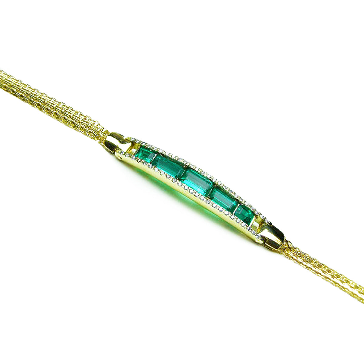 Gold bracelet with five Muzo colombian emeralds on a white background.