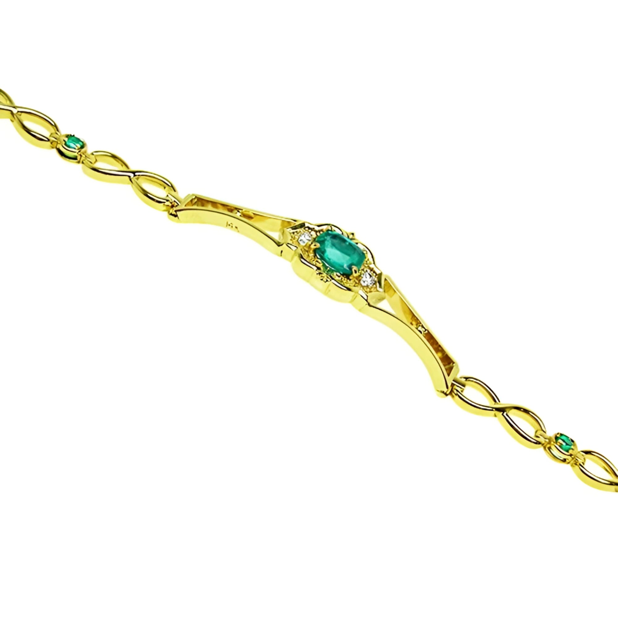 14K yellow gold women's bracelet with a central oval emerald and small emerald accents.