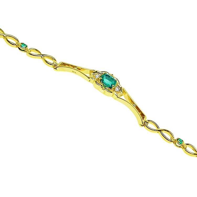 14K yellow gold women's bracelet with a central oval emerald and small emerald accents.