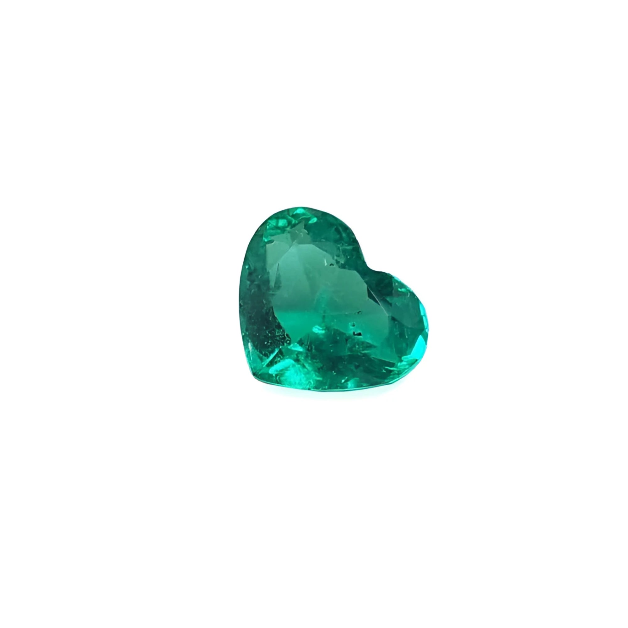 Heart cut loose natural colombian emerald premium loose gem with a rich bluish-green color.