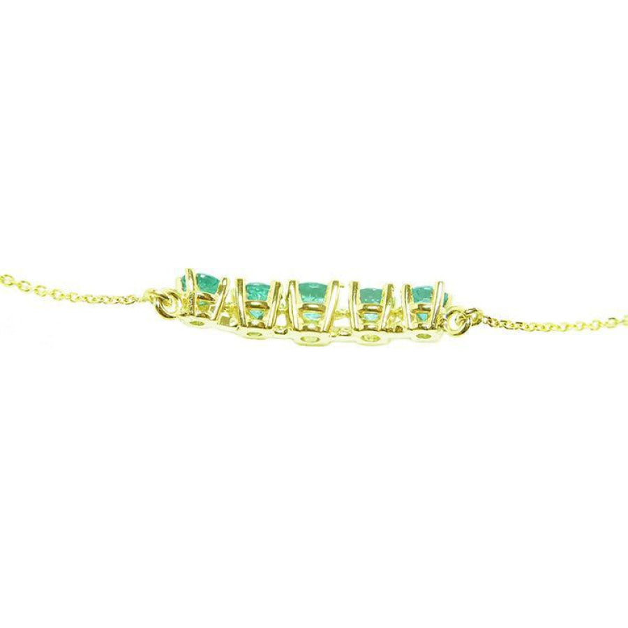 Sparkling 14K gold necklace with five round-cut medium light green Colombian emeralds.