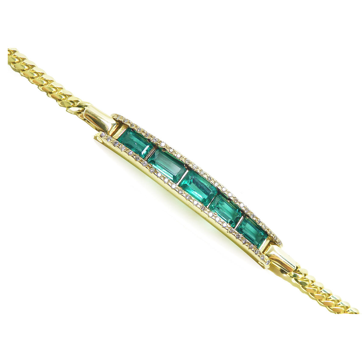 Gold bracelet with emeralds and diamonds on a side profile view.