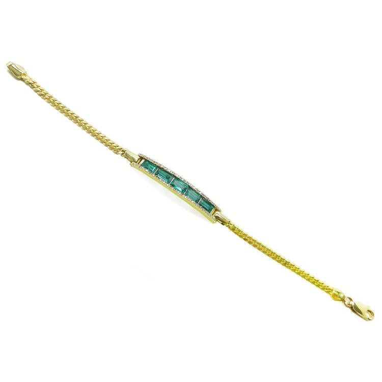 14K yellow gold bracelet with baguette emeralds and diamond accents.