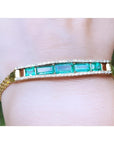 A five stone emerald bracelet natural Colombian emeralds fine quality made of 18k yellow gold for women. 
